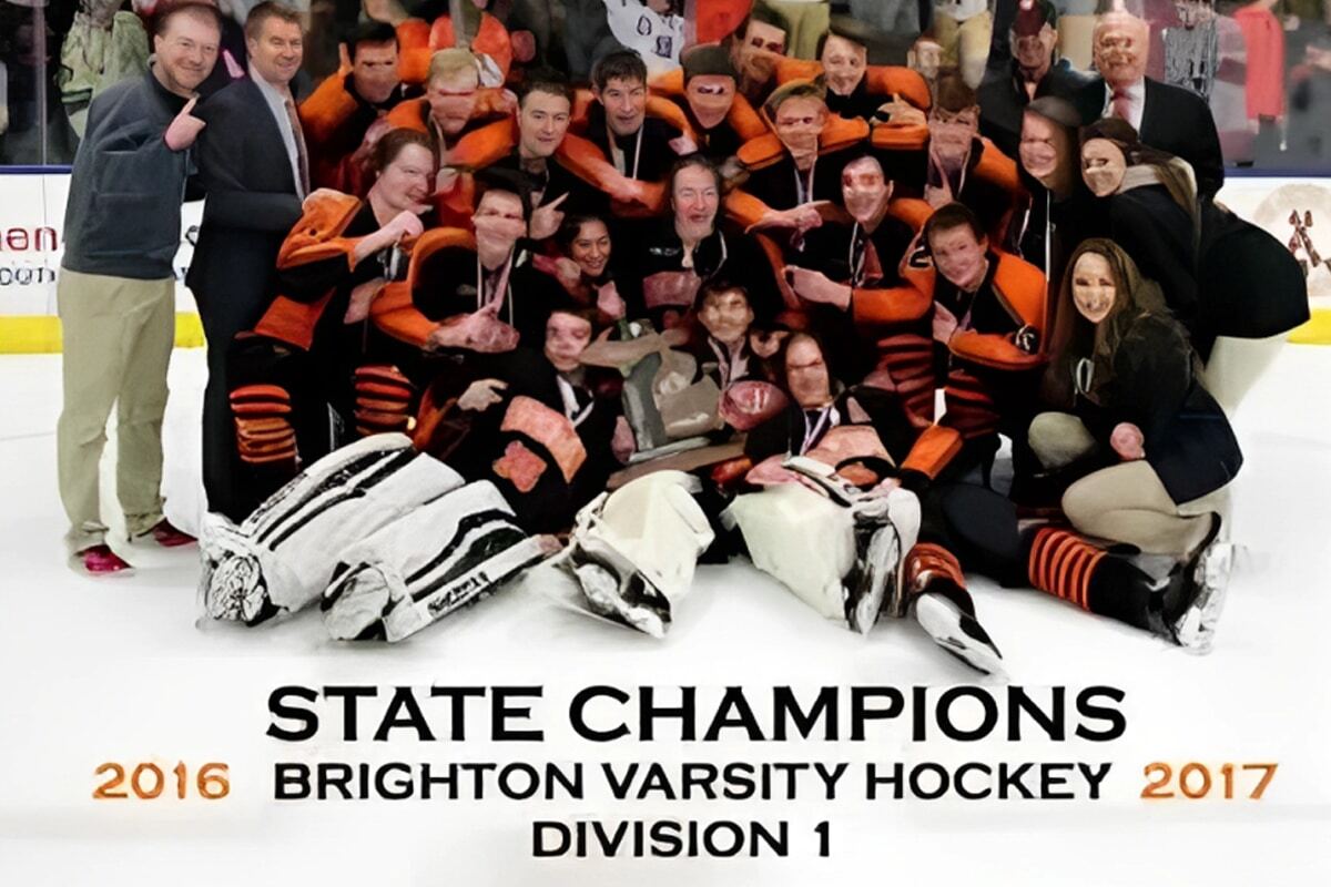 Brighton Varsity Hockey team celebrates 2016-2017 Division 1 state championship victory.