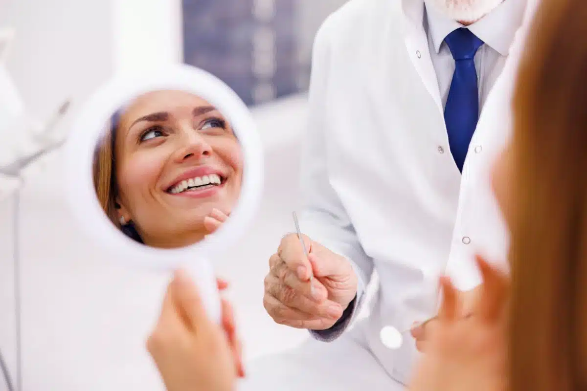 Cosmetic dentist Brighton explaining teeth whitening with crowns veneers and fillings